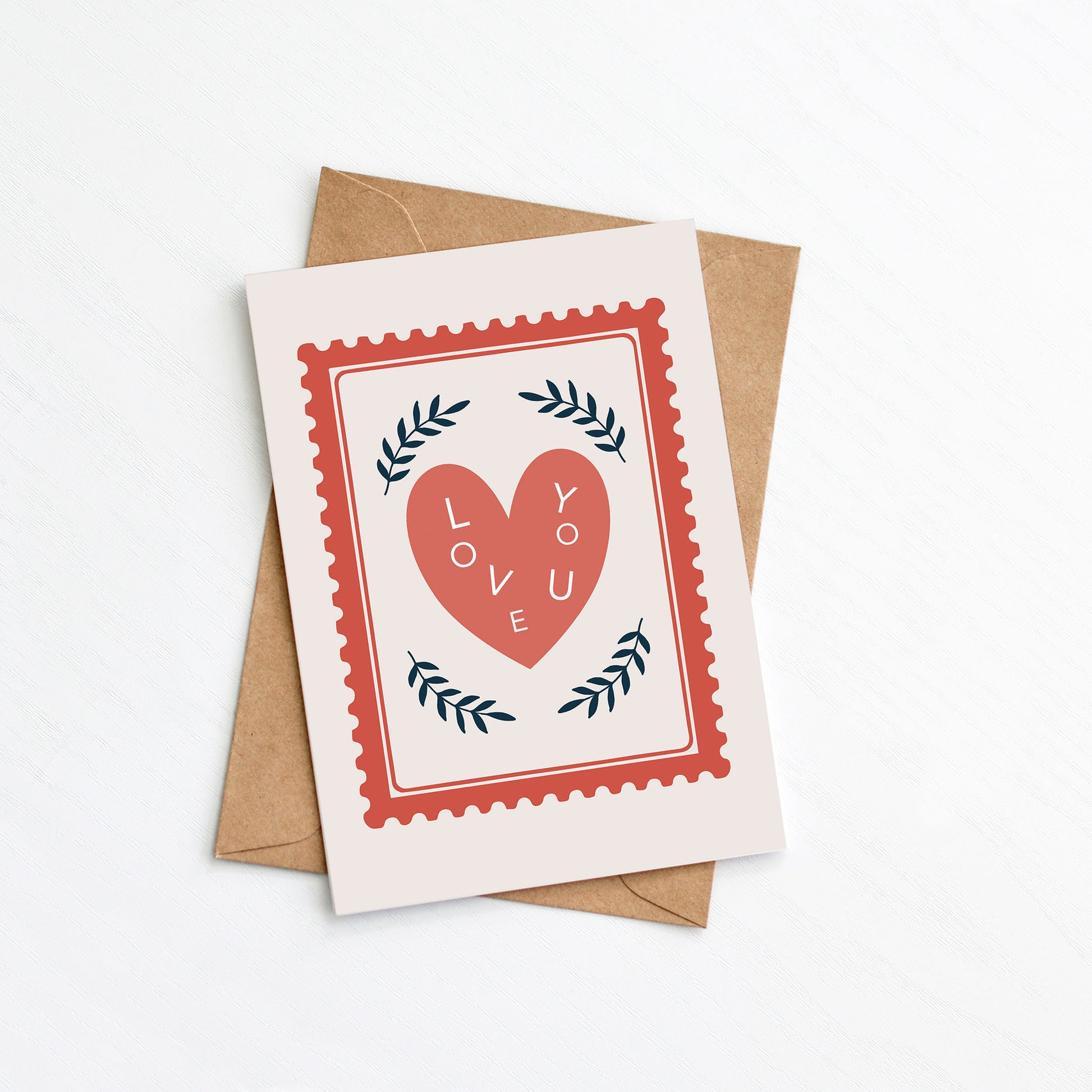 Greeting card with heart design and 'love you' text on a cream background